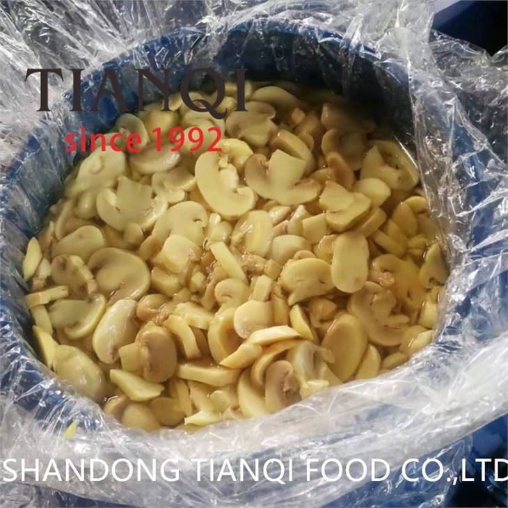 Conserved sliced white mushroom in drums